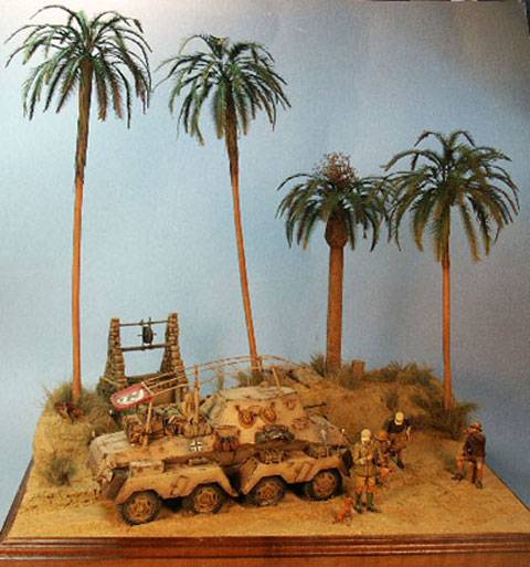 Diorama a escala 1/35 que representa a un grupo de soldados del Dak en el norte de Africa, descansando y reponiendo fuerzas en un Oasis.